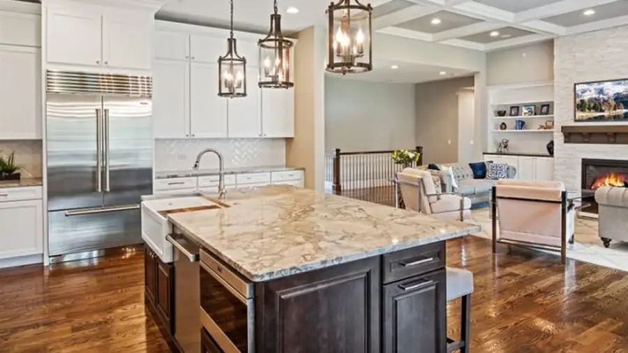 Finished kitchen with island and custom cabinetry by Skycrest Homes