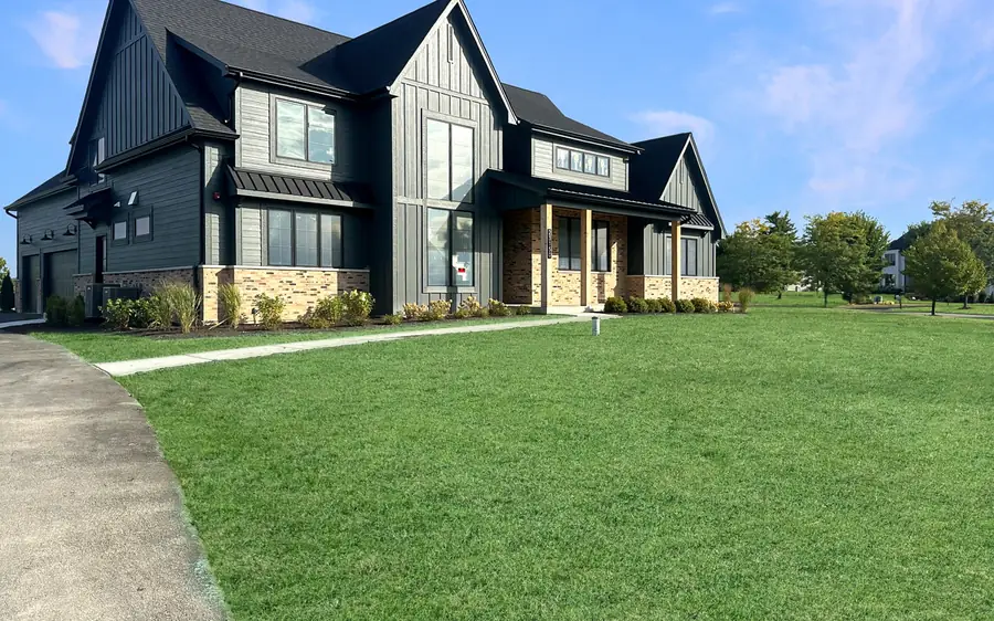 Custom Home with a Two-Story Living Room by Skycrest Homes