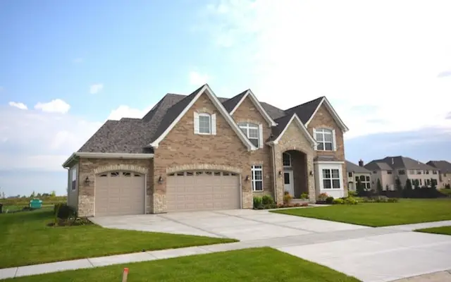 Brick and Stone Custom Home in Ashwood Park by Skycrest Homes