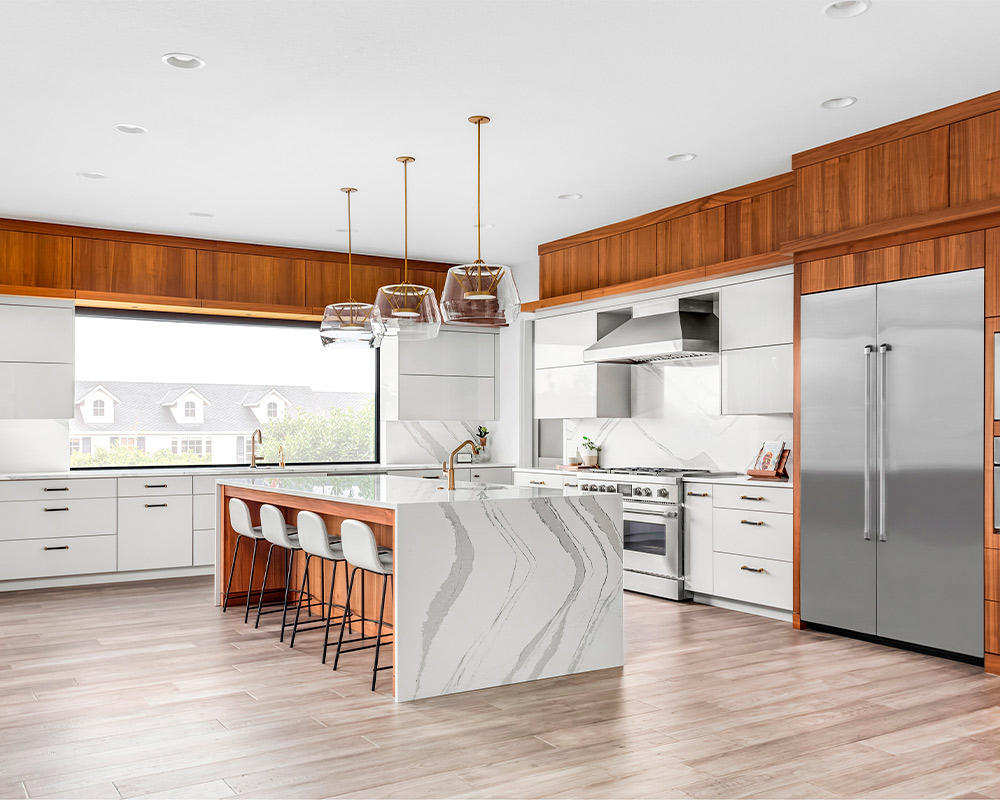 Spacious kitchen with a large island and stainless steel appliances, reflecting current kitchen remodeling trends in Barrington.