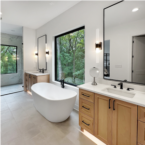 Luxury master bathroom remodeling project in Chicagoland featuring a freestanding tub and custom wood vanity
