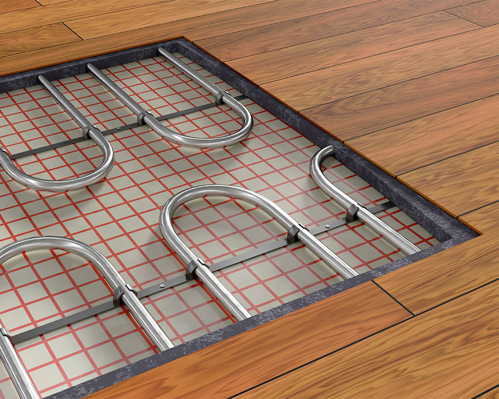 A floor heating system with metal pipes and grid, showcasing smart remodeling tips for winter-proofing basements in Chicago.